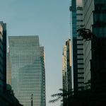 Modern glass office towers in a city business district, evoking the Nairobi skyline that will host Africa Global PR Week 2026