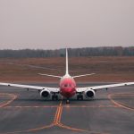 commercial airliner on an airport runway, daytime