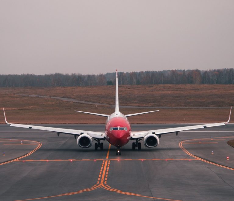 commercial airliner on an airport runway, daytime