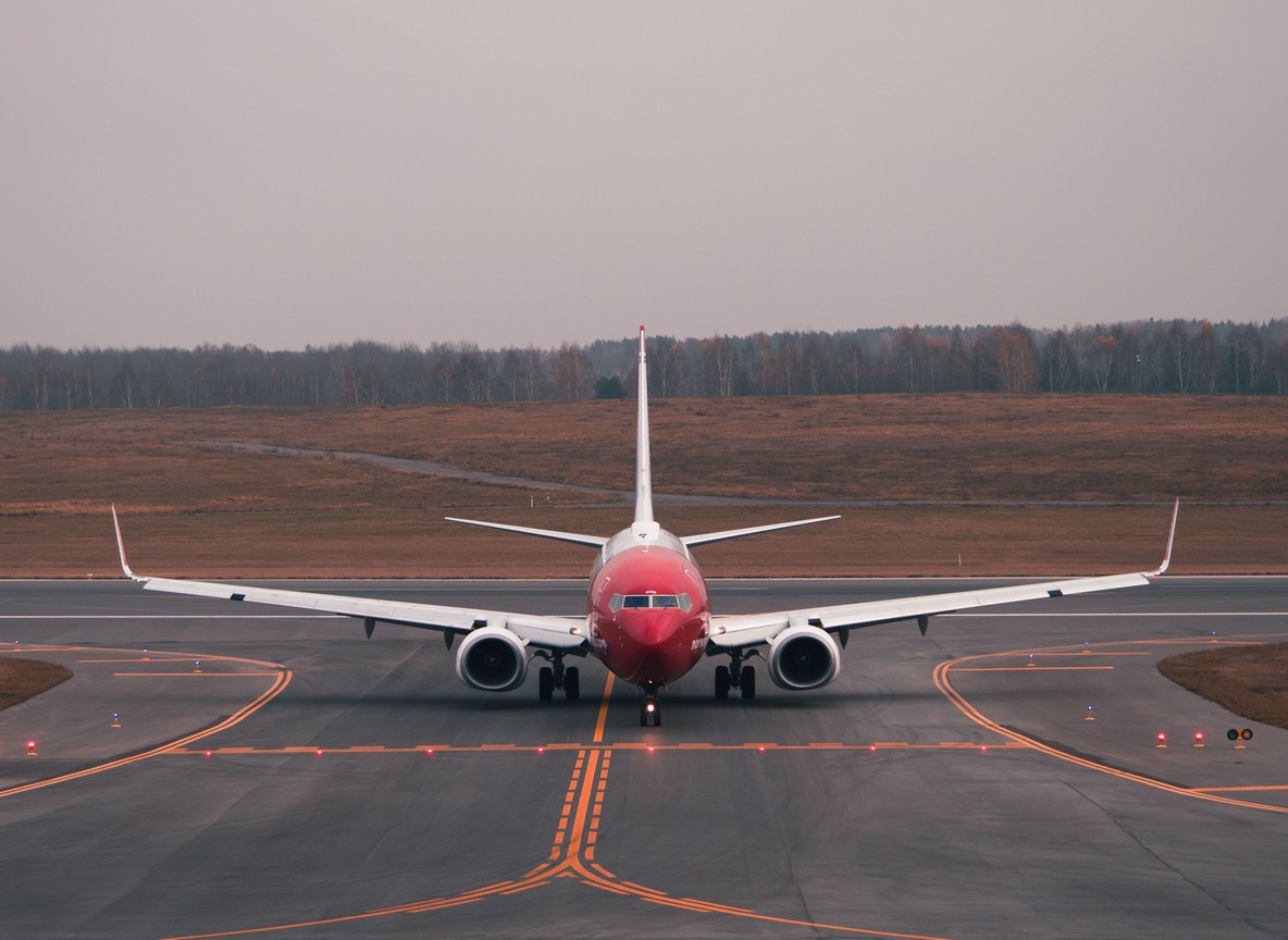 commercial airliner on an airport runway, daytime