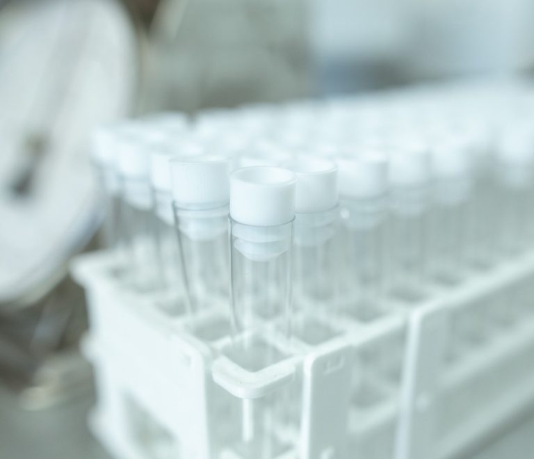 a rack of sample tubes used for genetic ancestry testing