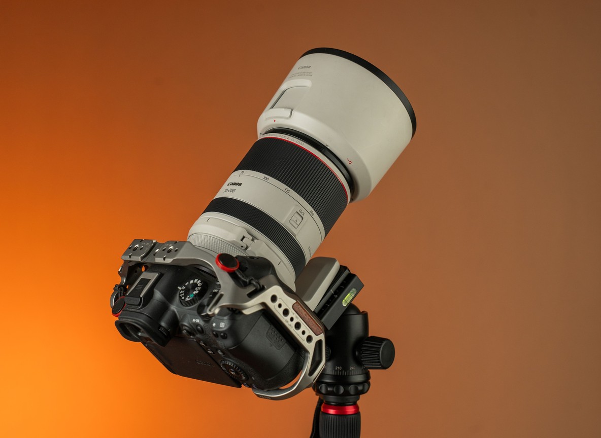 Professional camera and telephoto lens set up on a tripod, the kind of gear that draws questions about commercial versus personal use on safari