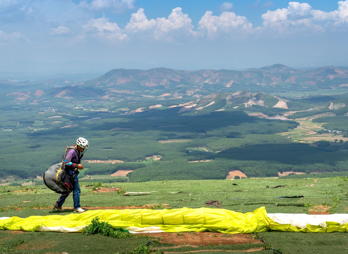 Paraglider launching off the Elgeyo escarpment near Kessup with the Kerio Valley floor visible far below