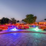 An exclusive-use luxury villa deck overlooking the Maasai Mara plains at sunset
