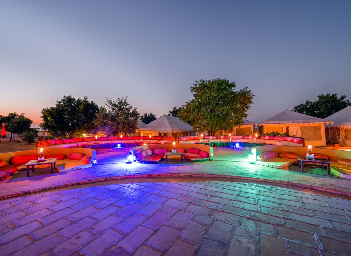 An exclusive-use luxury villa deck overlooking the Maasai Mara plains at sunset