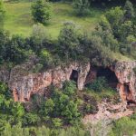 the sheer cedar-forested wall of the Nguruman Escarpment rising above the Rift Valley floor near Lake Magadi