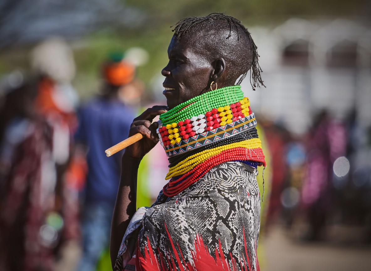 close-up portrait of a Maasai woman wearing traditional layered beaded neck rings