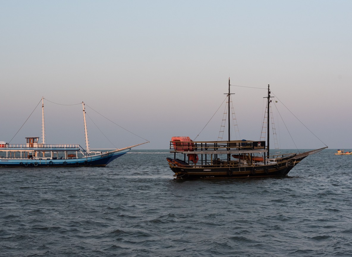Traditional sailing boats on the Kenya coast at dusk
